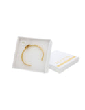 Brazalete Redondo Piedrita Blanca y bolitas Doradas
