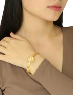 Brazalete Redondo Piedrita Blanca y bolitas Doradas