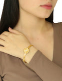 Brazalete Redondo Piedrita Blanca y bolitas Doradas